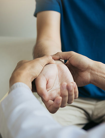 doctor examining wrist